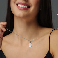 Thumbnail for Model wearing Glitter Initial Necklace by Brother & Sisters, showcasing a sparkling personalized letter pendant.