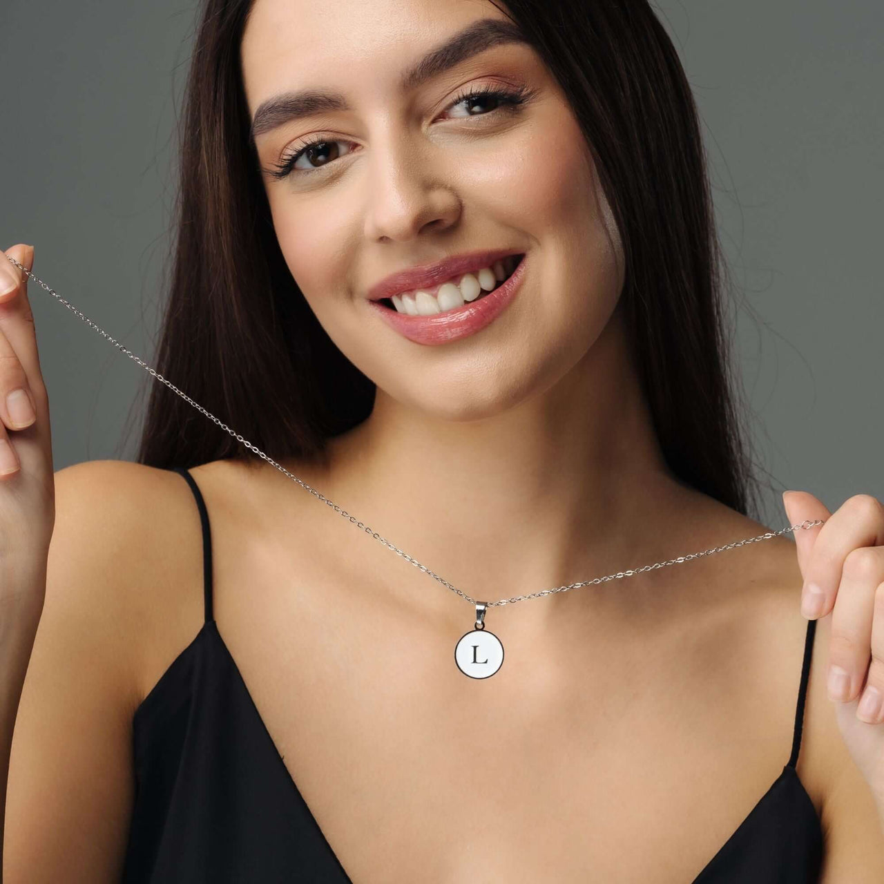Woman wearing Dreamy Initial Necklace with personalized letter pendant, showcasing elegance and style by Brother & Sisters.