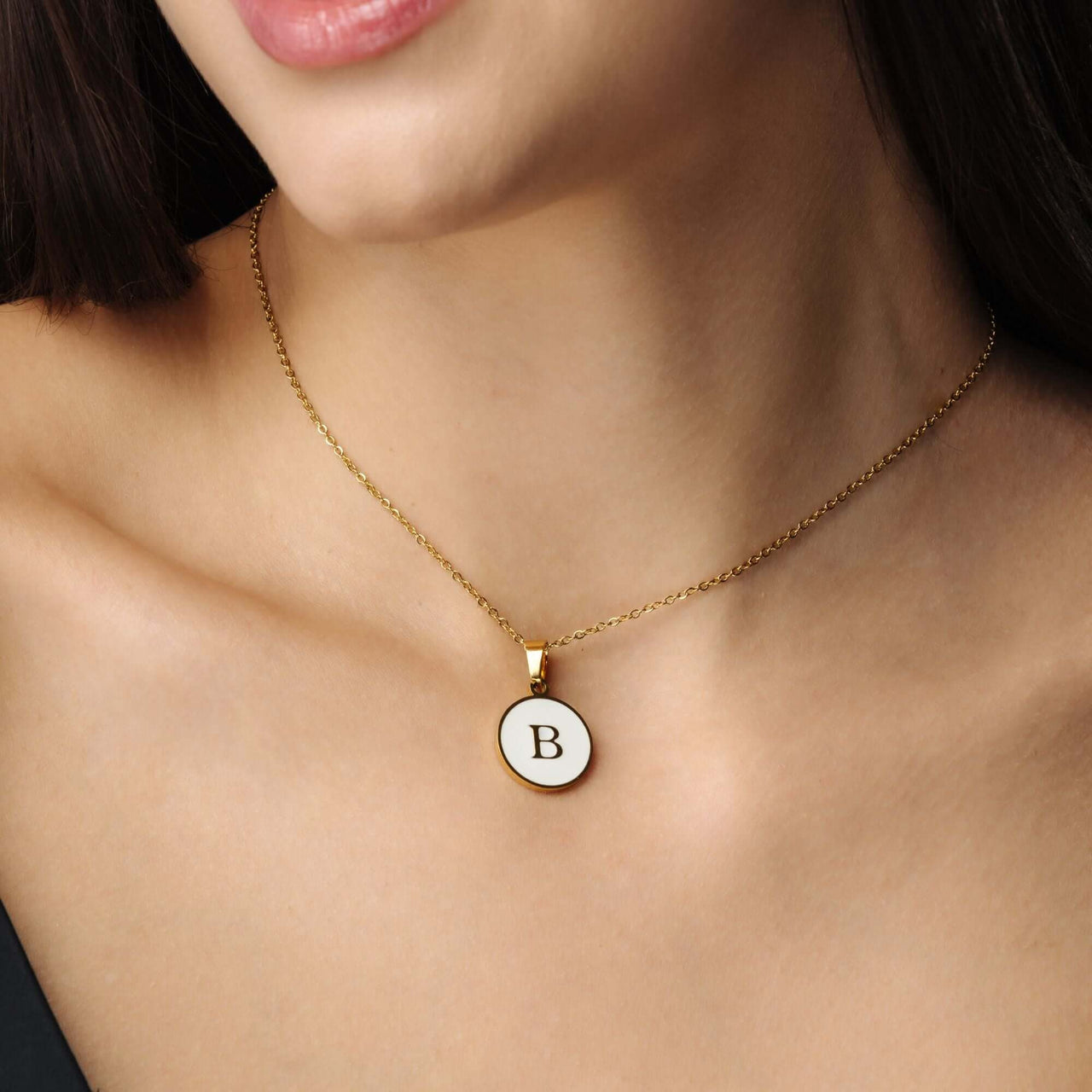Dreamy Initial Necklace on a woman, featuring a gold chain and personalized initial 'B', by Brother & Sisters.