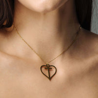 Thumbnail for Heart Initial Necklace from Brother & Sisters featuring a gold heart pendant with an initial.