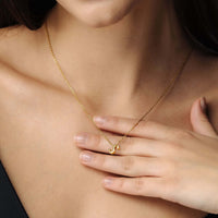 Thumbnail for Iconic Initial Necklace worn by a woman, showcasing its gold elegance from Brother & Sisters.
