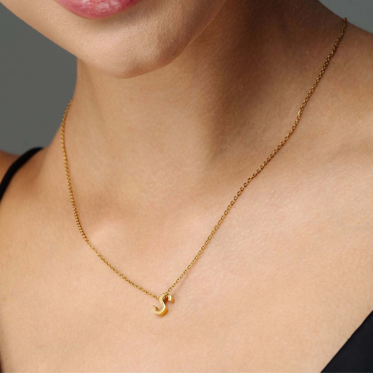 Iconic Initial Necklace by Brother & Sisters featuring a gold letter 'S' pendant, adding personalized elegance.