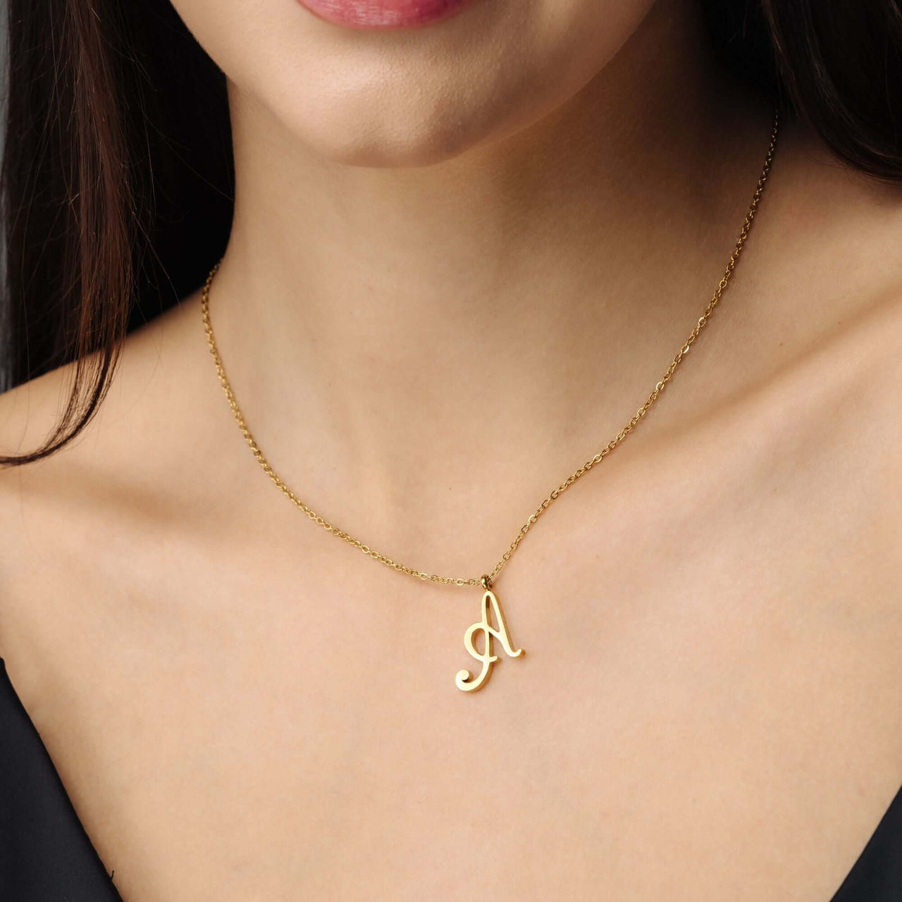 Minimalist Initial Necklace by Brother & Sisters featuring a gold necklace with an elegant initial pendant.