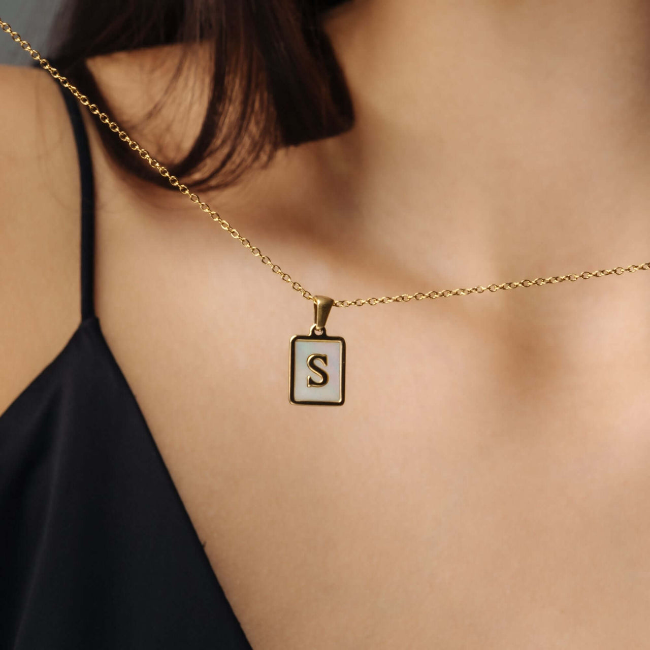 Happiness Initial Necklace featuring an elegant 'S' pendant on a gold chain by Brother & Sisters.