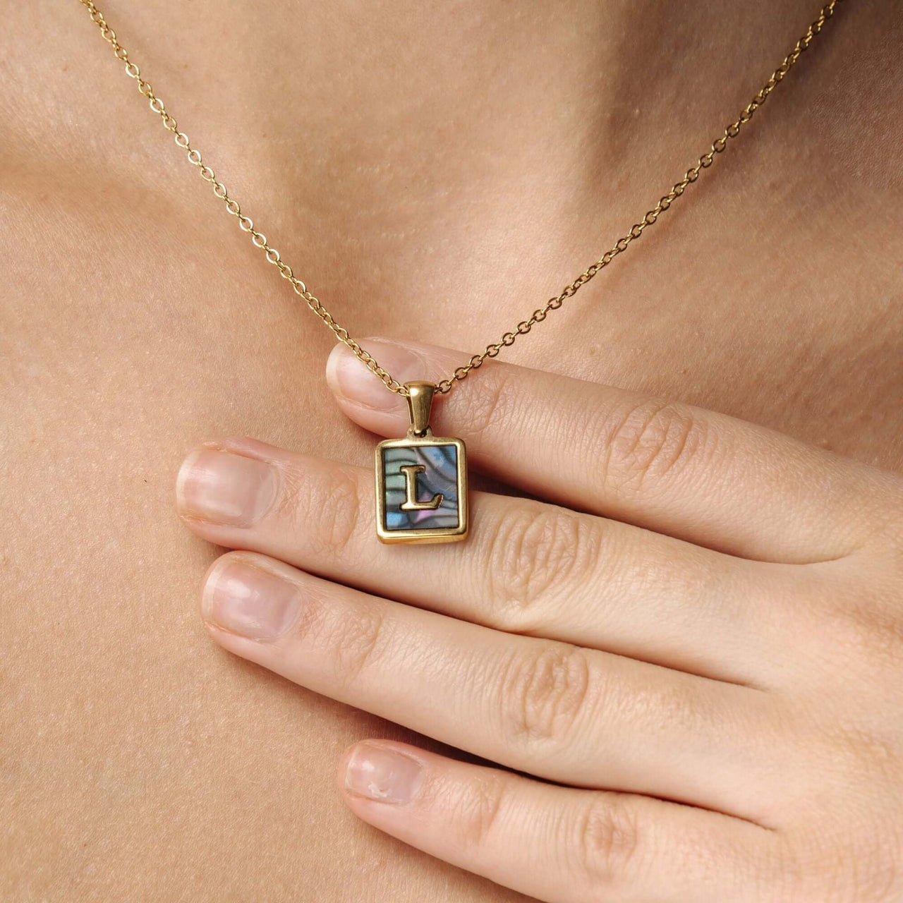 Happiness Initial Necklace featuring a gold pendant with the letter L, crafted by Brother & Sisters for women.