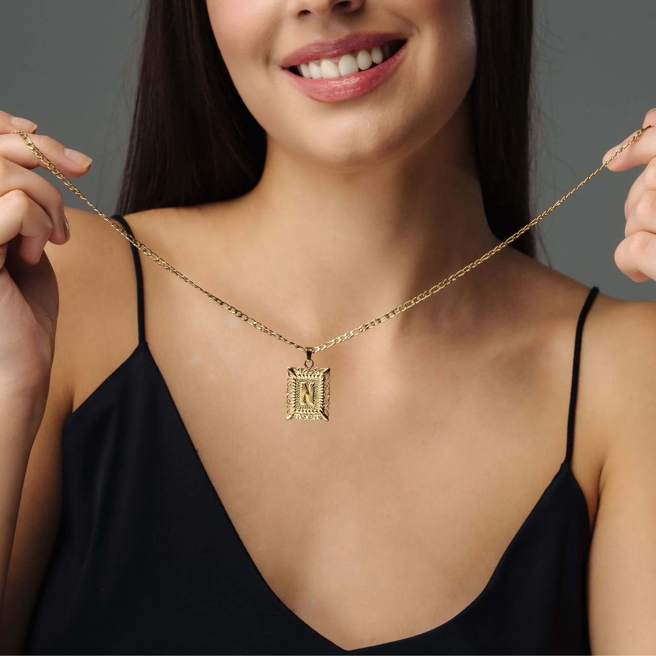 Vintage Initial Necklace worn by a woman, featuring a delicate letter charm and a gold chain from Brother & Sisters.