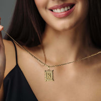 Thumbnail for Vintage Initial Necklace worn by a woman showcasing the gold letter charm from Brother & Sisters.