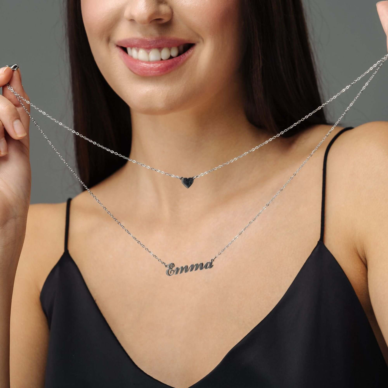 Heart Name Necklace by Brother & Sisters showcased on a model, featuring a custom nameplate and heart charm.