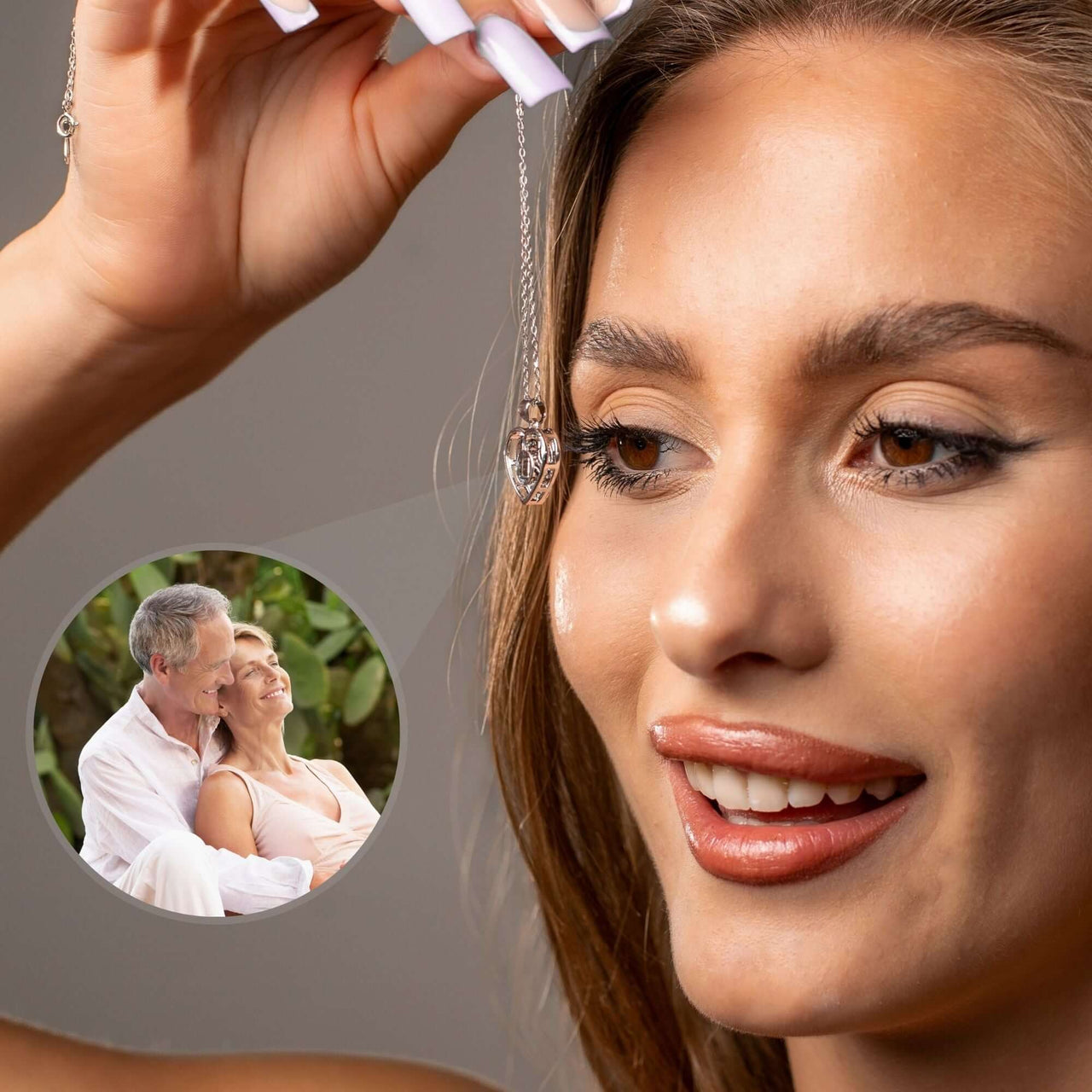Woman showcasing Hearts Photo Necklace by Brother & Sisters, holding heart-shaped locket with photo projection.