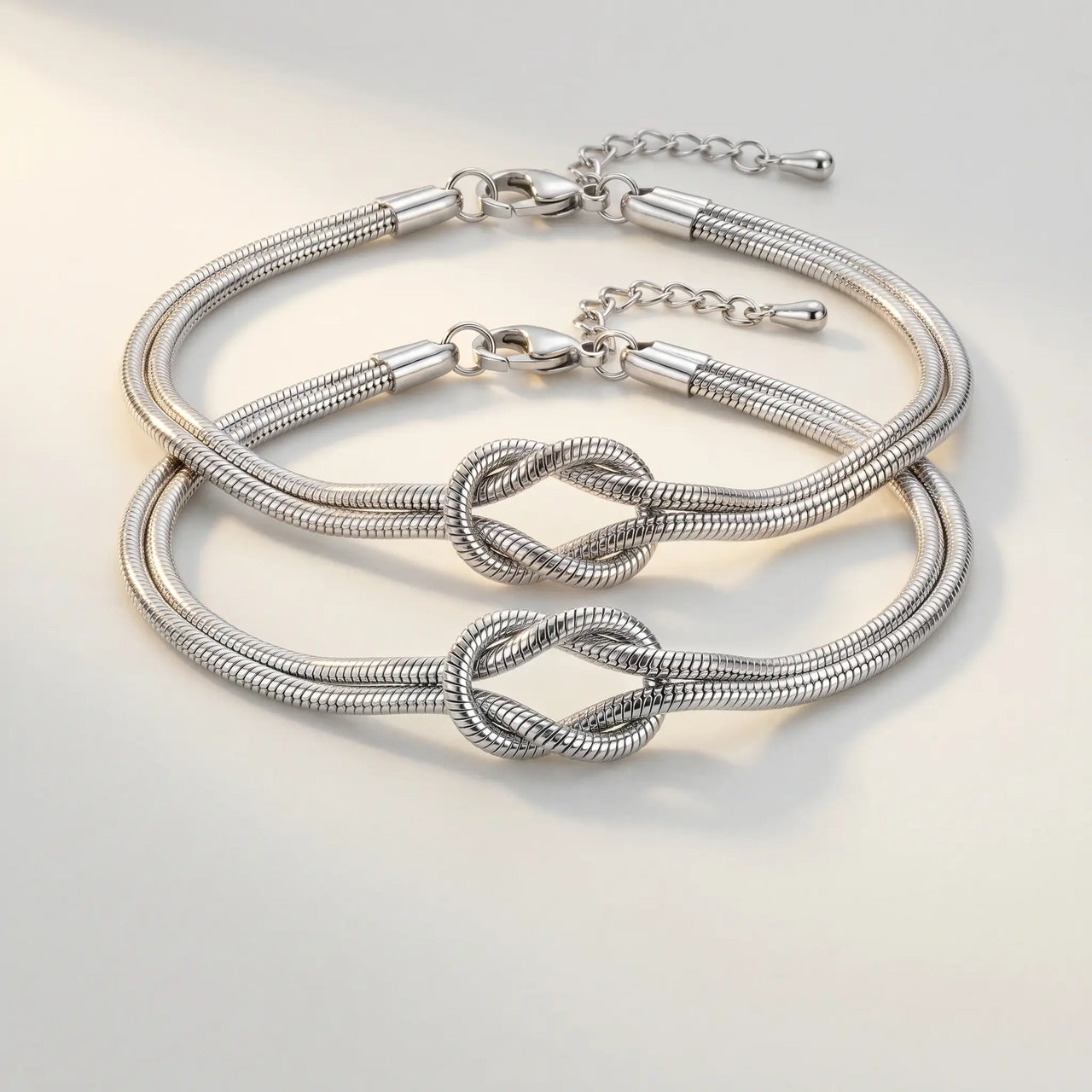 Lane B v2 Knot Couple Bracelet silver packshot pair hero cool ivory paper Mejuri delicate daily editorial