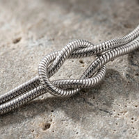 Thumbnail for Lane B v2 Knot Couple Bracelet silver macro detail love knot weathered concrete artisan close-up