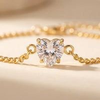 Thumbnail for Heart-shaped crystal in 4-prong solitaire setting, gold macro detail