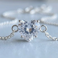 Thumbnail for Heart-shaped crystal in 4-prong solitaire setting, silver macro detail