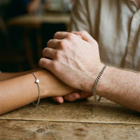 Thumbnail for Silver couple holding hands cafe table