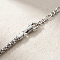 Thumbnail for Maëlle silver anklet macro detail — polished swivel lobster clasp + figaro extension chain + tube-mesh popcorn woven cylindrical chain on cream linen, premium hardware