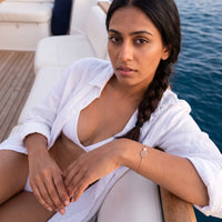 Thumbnail for Woman on a yacht wearing the rose gold charm bracelet | SKU: 9178613-rose-gold