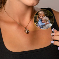 Thumbnail for Love Photo Necklace featuring a heart-shaped pendant displaying a cherished photo.