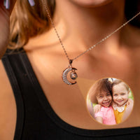 Thumbnail for Lucky Moon Photo Necklace featuring a crescent moon charm projecting a photo, by Brother & Sisters.
