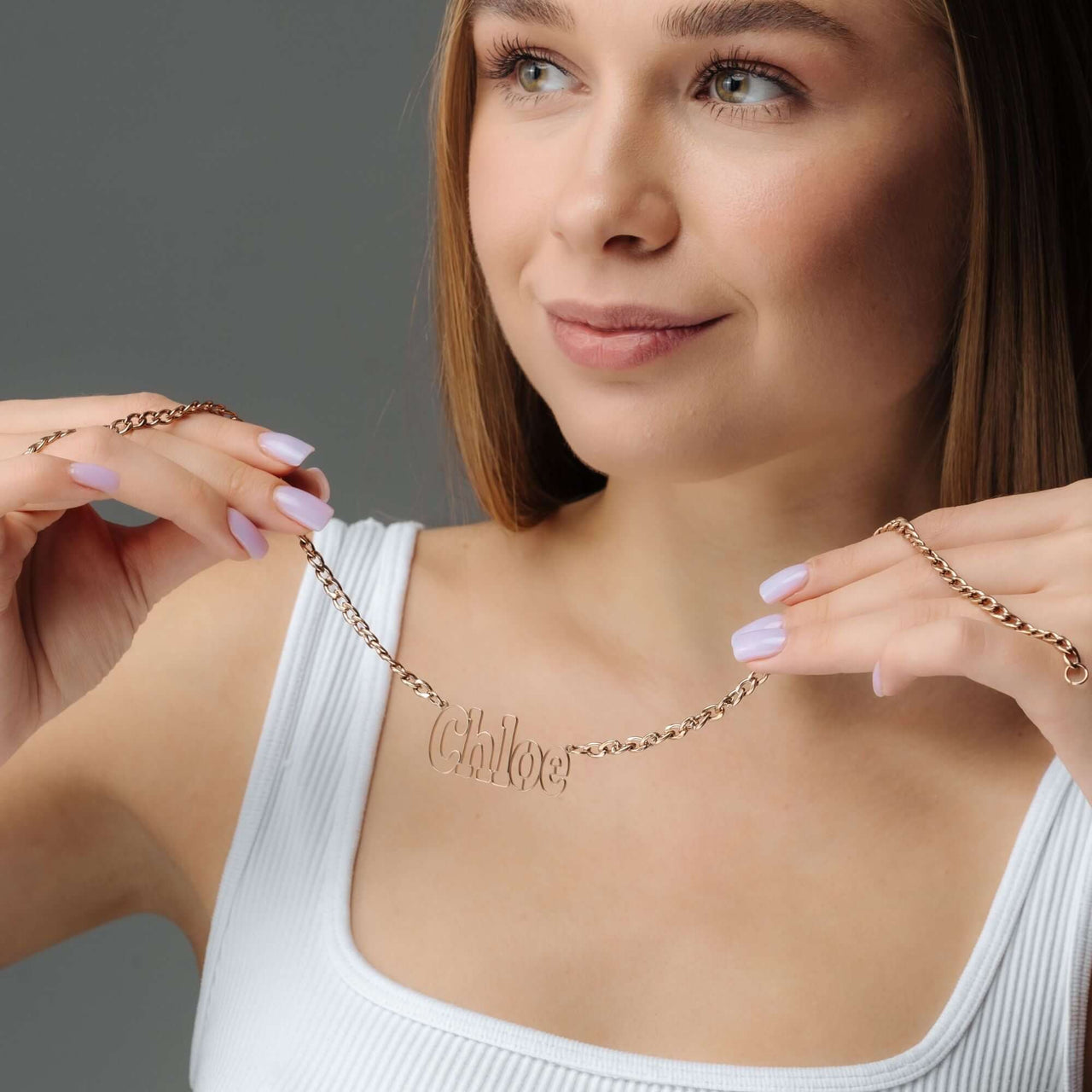 Luxury Name Necklace by Brother & Sisters featuring personalized name design worn by a model.