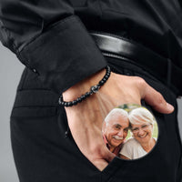 Thumbnail for Minimalist Photo Bracelet worn by a man, featuring a pocket photo of a happy elderly couple, handcrafted by Brother & Sisters.