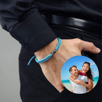 Thumbnail for Man Blue Photo Bracelet on wrist with photo pendant, featuring a couple enjoying a beach day, by Brother & Sisters.
