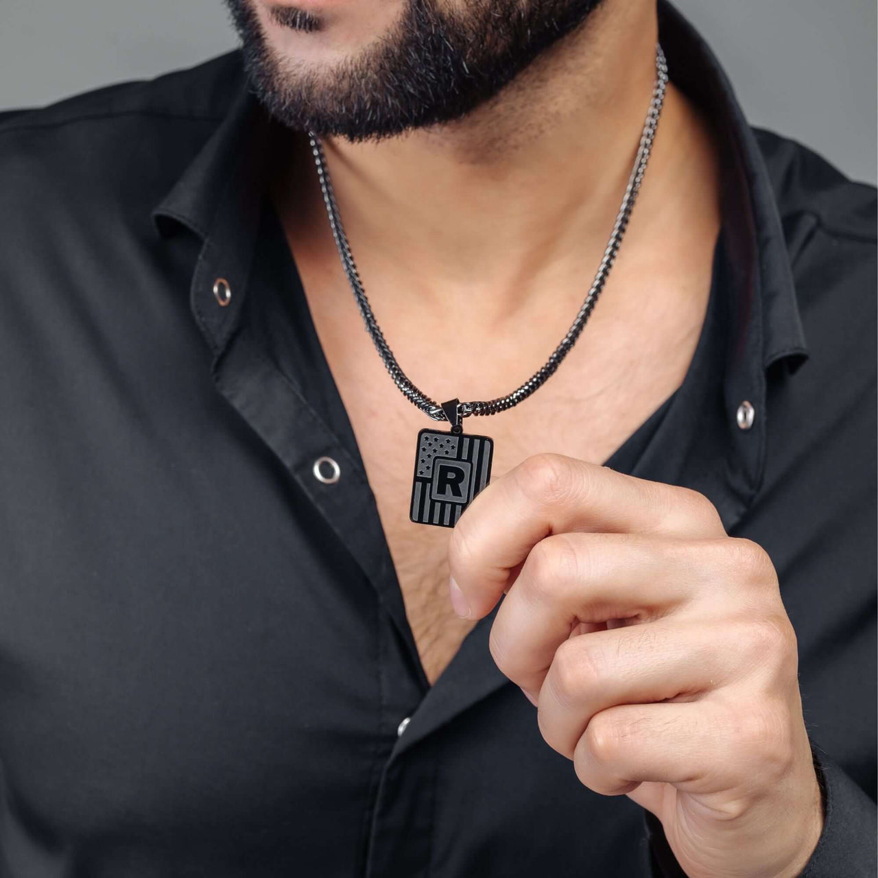 Military Initial Necklace worn by a man, featuring a military-inspired letter pendant from Brother & Sisters.