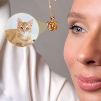 Thumbnail for Close-up of a woman wearing a Meow Photo Necklace featuring her beloved cat's photo. By Brother & Sisters.