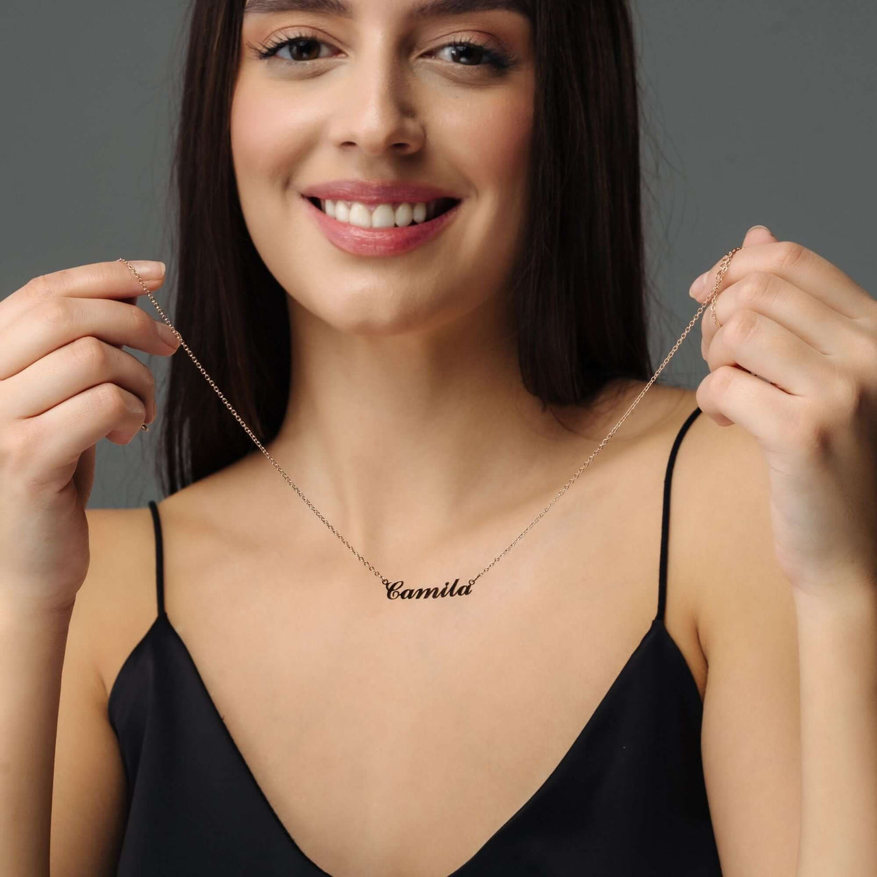 Minimalist Name Necklace worn by a woman, personalized with the name Camila, from Brother & Sisters.