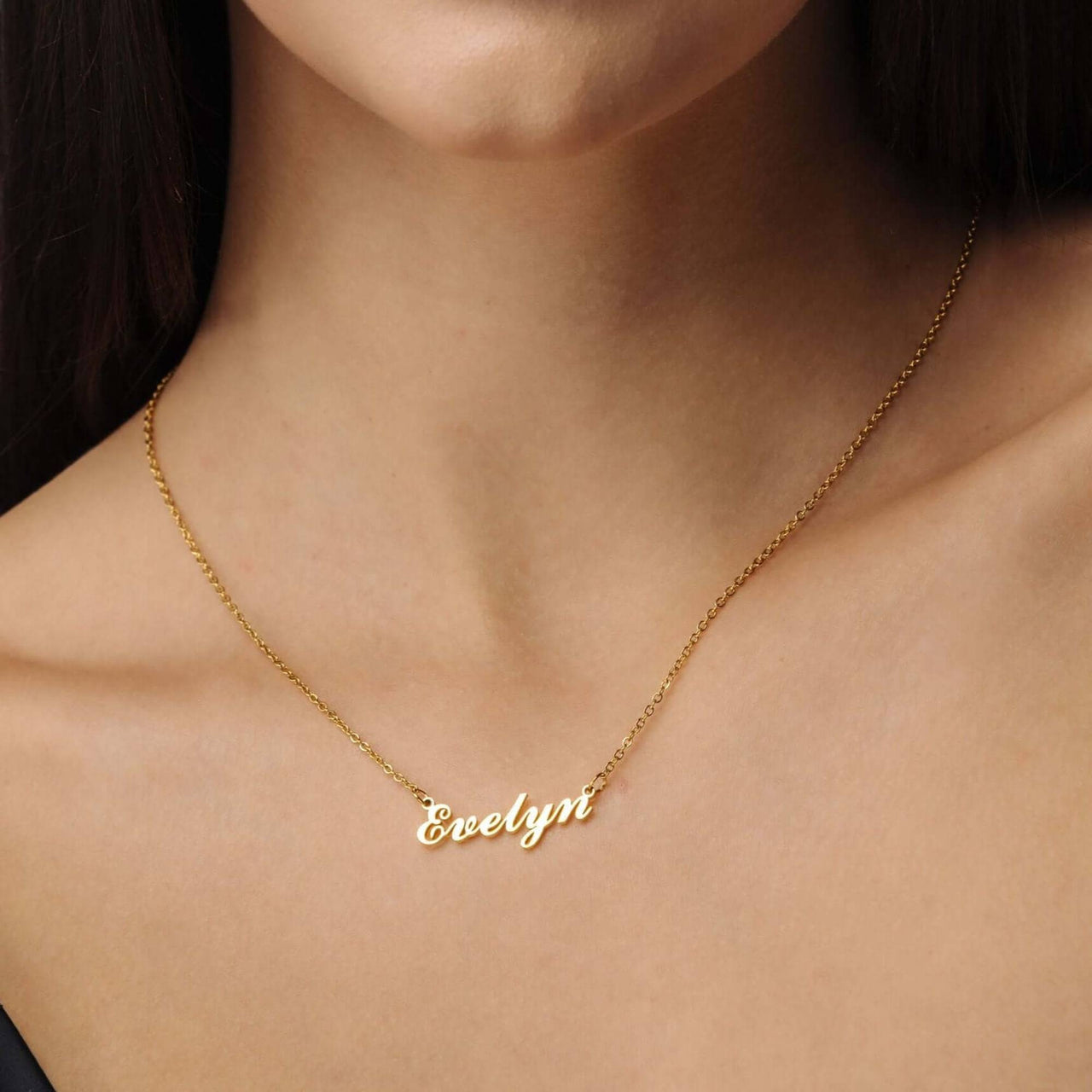Minimalist Name Necklace by Brother & Sisters, featuring a gold name pendant 'Evelyn' on a delicate chain.