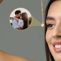 Thumbnail for Moonlight Photo Necklace featuring a close-up of a woman wearing the necklace with a photo pendant showcasing a couple.