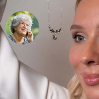 Thumbnail for Nature Photo Necklace by Brother & Sisters showcasing a woman wearing it, projecting a loved one's photo.