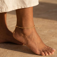 Thumbnail for Oval Bead Anklet by Brother & Sisters featuring smooth gold beads enhancing ankle elegance.