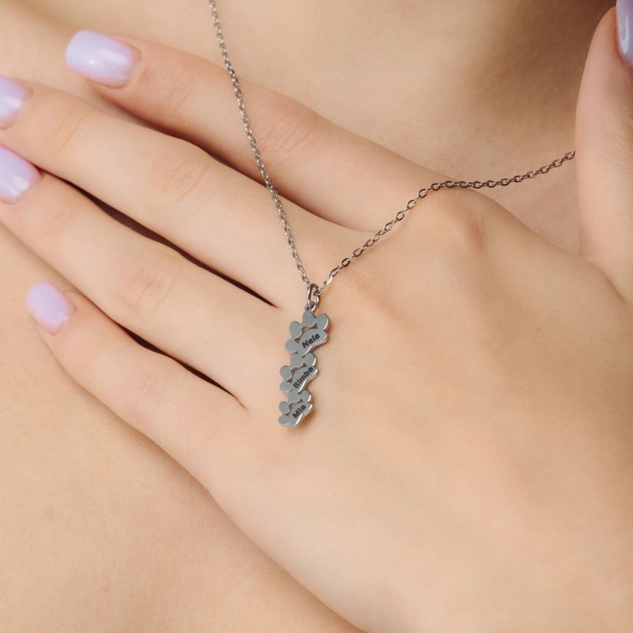 Paw Name Necklace by Brother & Sisters featuring a unique design with customizable name charms.