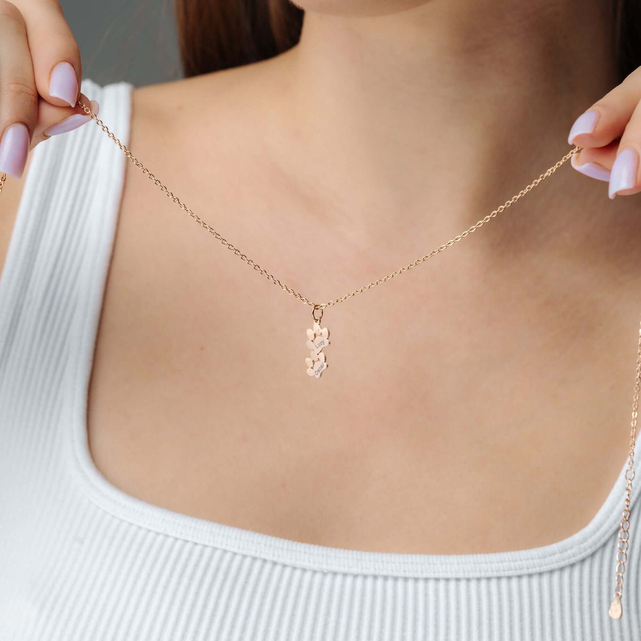 Paw Name Necklace displayed on a model, showcasing the unique personalized design by Brother & Sisters.