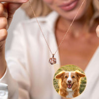Thumbnail for Woman holding Paw Print Photo Necklace showcasing personalized pet photo, designed by Brother & Sisters.