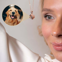 Thumbnail for Woman wearing Paw Print Photo Necklace showing personalized pet photo projection by Brother & Sisters.
