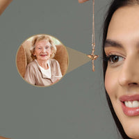 Thumbnail for Woman wearing a Protection Photo Necklace featuring a cherished photo of a loved one, by Brother & Sisters.