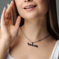 Thumbnail for Queen Name Necklace by Brother & Sisters worn by a woman, featuring a personalized 'Victoria' name design.
