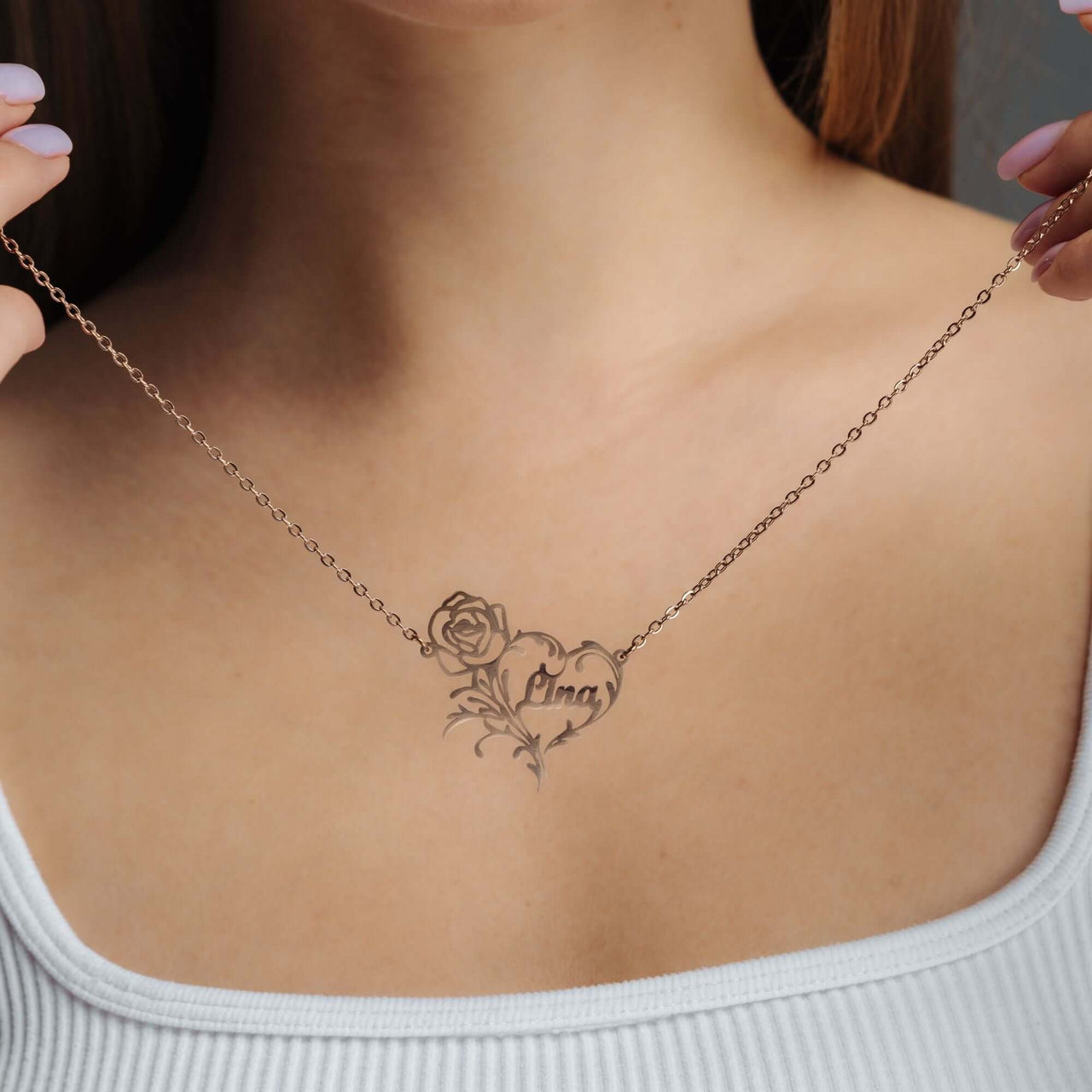Rose Name Necklace showcasing a personalized design with a rose, crafted in rose gold by Brother & Sisters.