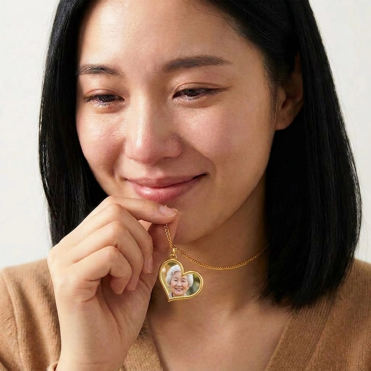 Woman moved to tears looking at her grandmother's photo in the secret heart necklace | SKU: TPH-HRTN-GOLD