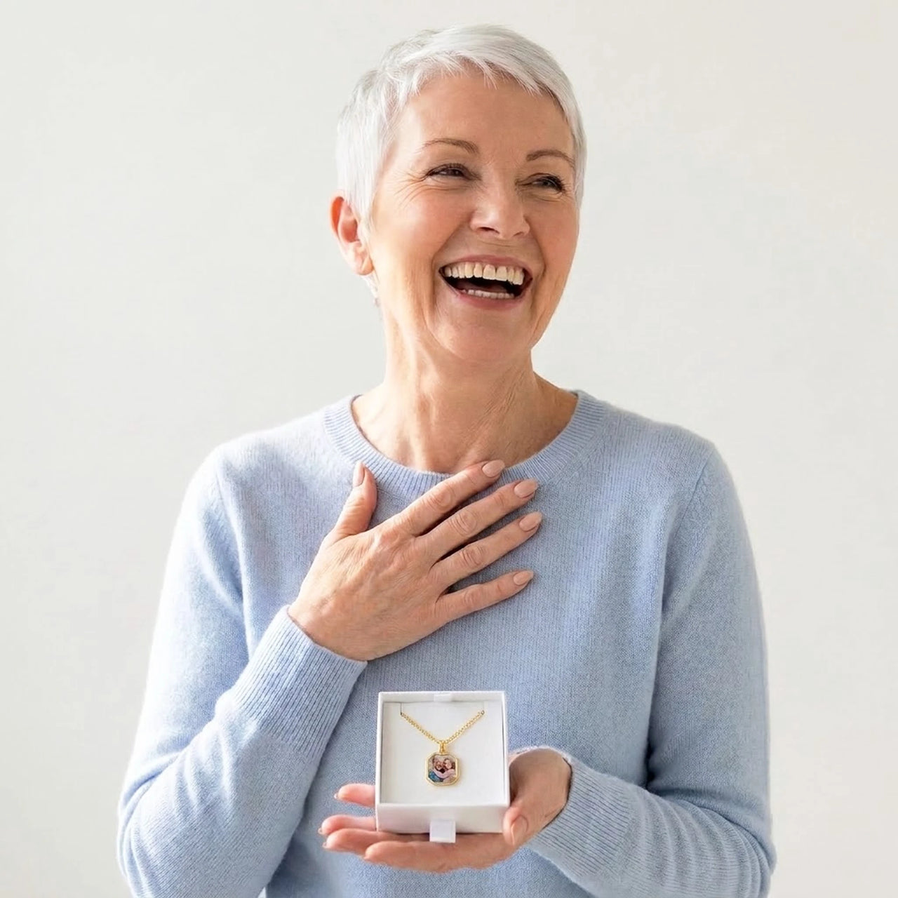 Grandmother discovering her grandchildren's photo in the gold octagon necklace gift box | SKU: TPH-OCTN-GOLD