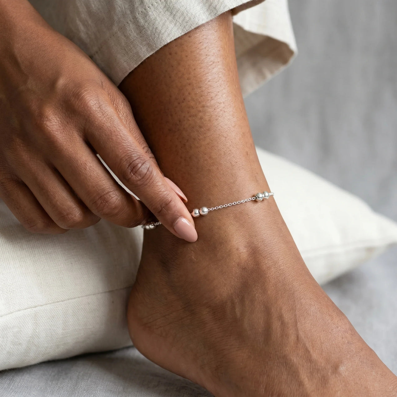 Silver Bead Anklet showcasing polished silver beads on a delicate chain, perfect for summer vibes by Brother & Sisters.
