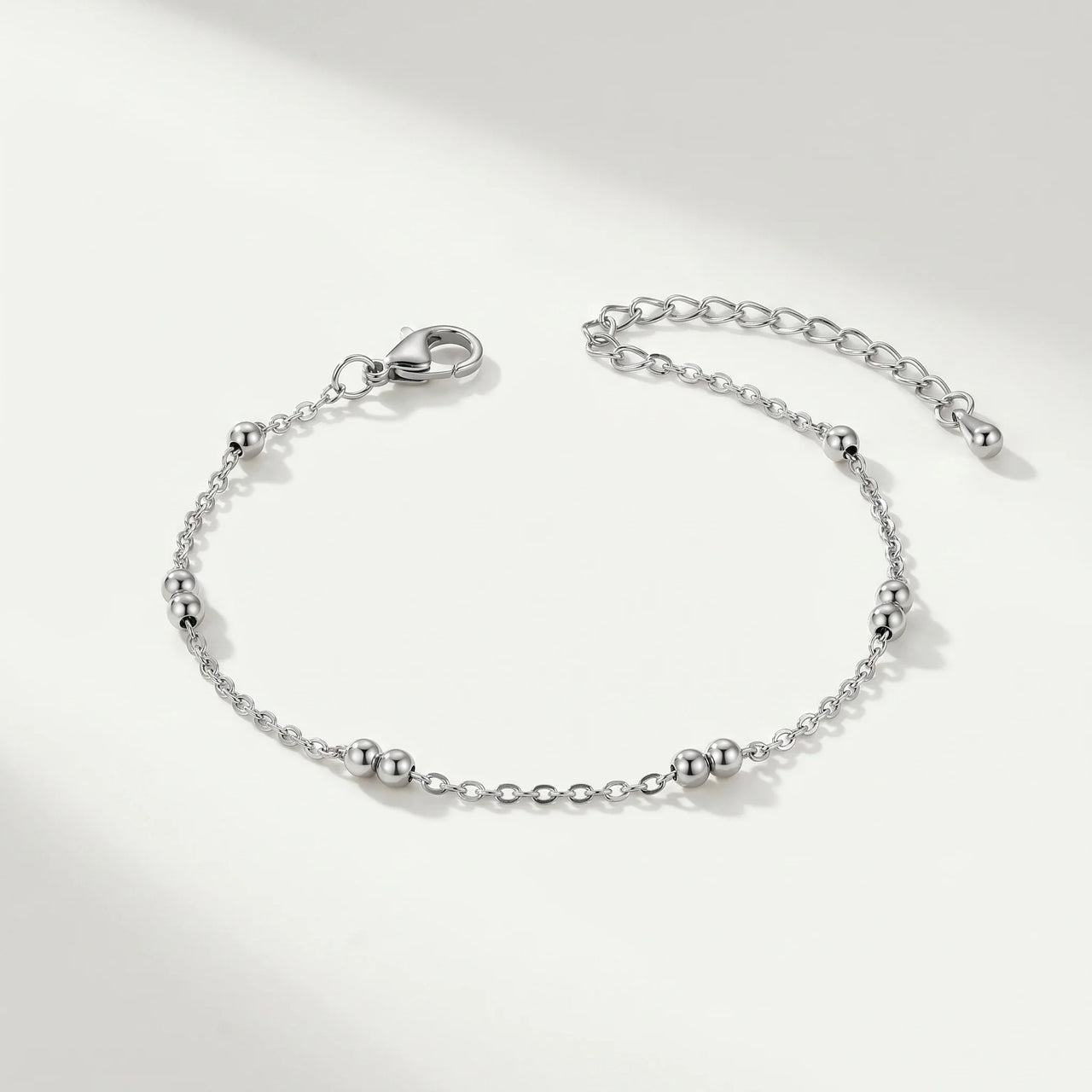 Silver Bead Anklet by Brother & Sisters, featuring delicate wire-thin chain and polished silver beads for summer elegance.