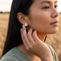 Thumbnail for Woman gently touching her silver stud earrings | SKU: 505185-white