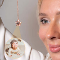 Thumbnail for Star Photo Necklace featuring a hidden photo projection of a baby, designed by Brother & Sisters, elegant keepsake jewelry.