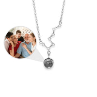 Thumbnail for Stars Photo Necklace by Brother & Sisters featuring hidden photo projection and constellation design.