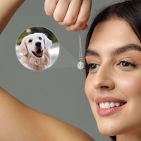 Thumbnail for Sunflower Photo Necklace projecting a photo of a golden retriever, worn by a smiling woman, by Brother & Sisters.