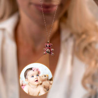 Thumbnail for Teddy Bear Photo Necklace featuring a baby photo projection, designed by Brother & Sisters, combining elegance with sentimentality.