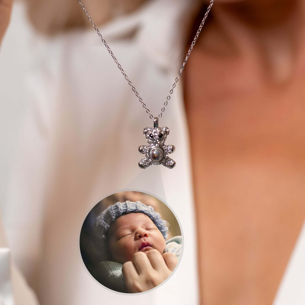 Teddy Bear Photo Necklace featuring a projection of a sleeping baby image, designed by Brother & Sisters.