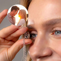 Thumbnail for Woman holding a Timeless Photo Necklace featuring a couple's photo, showcasing love and memory by Brother & Sisters.